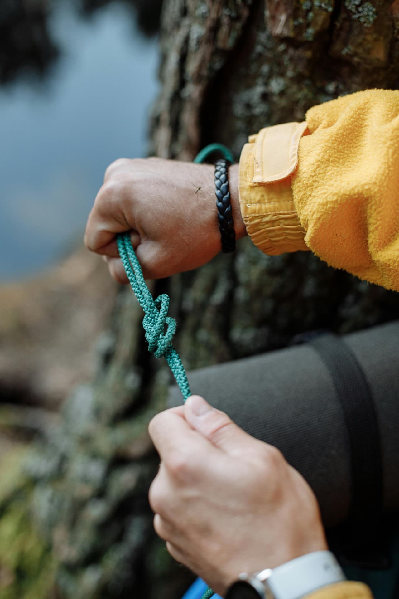 Thomas hands tying custom tactical paracord knots